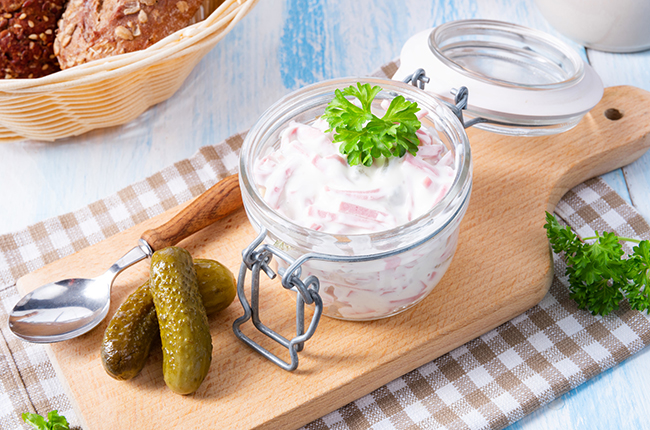 delicious homemade meat salad with mayonnaise and cucumber